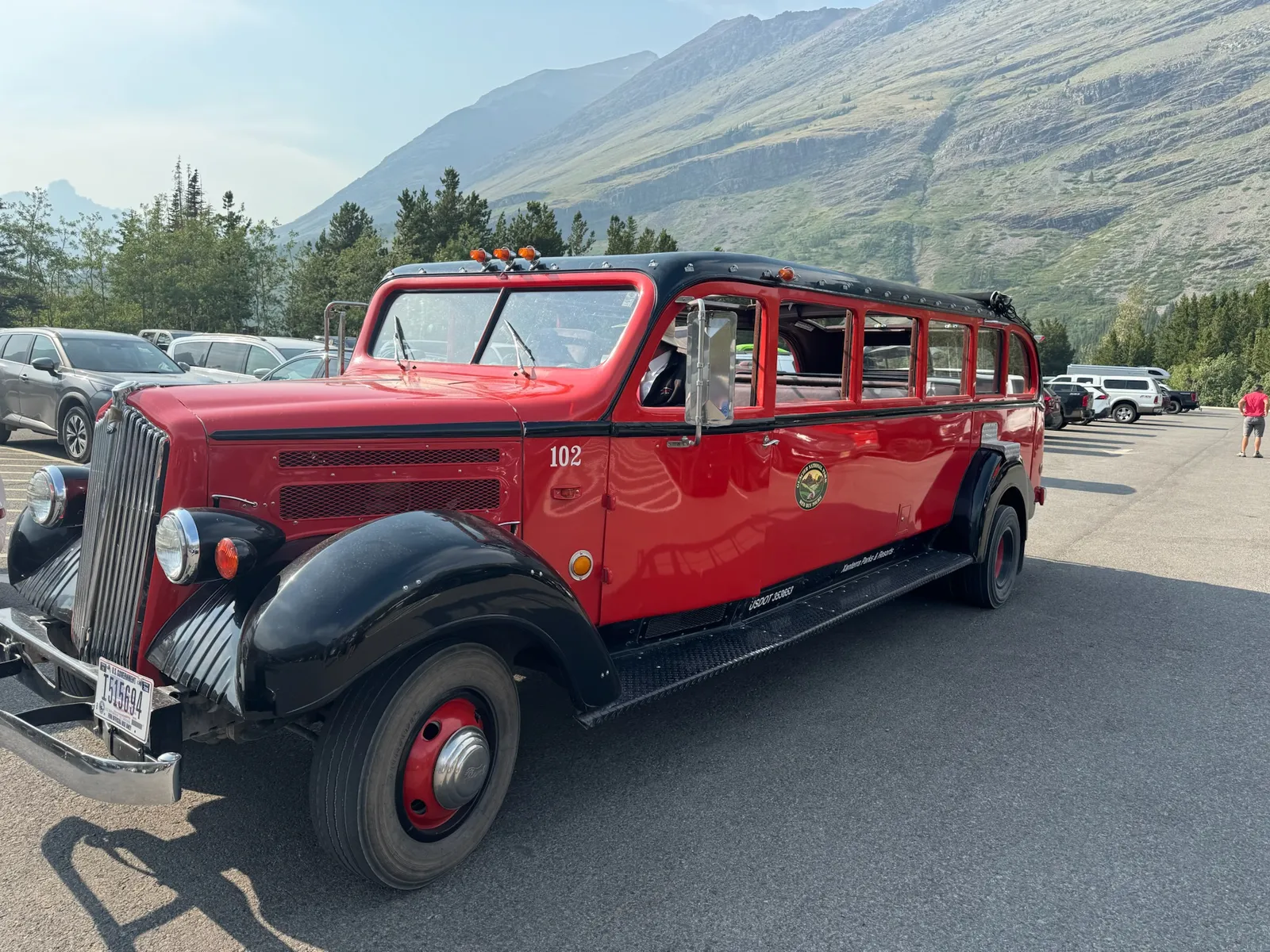 Red bus 102 in Glacier National Park, 2024